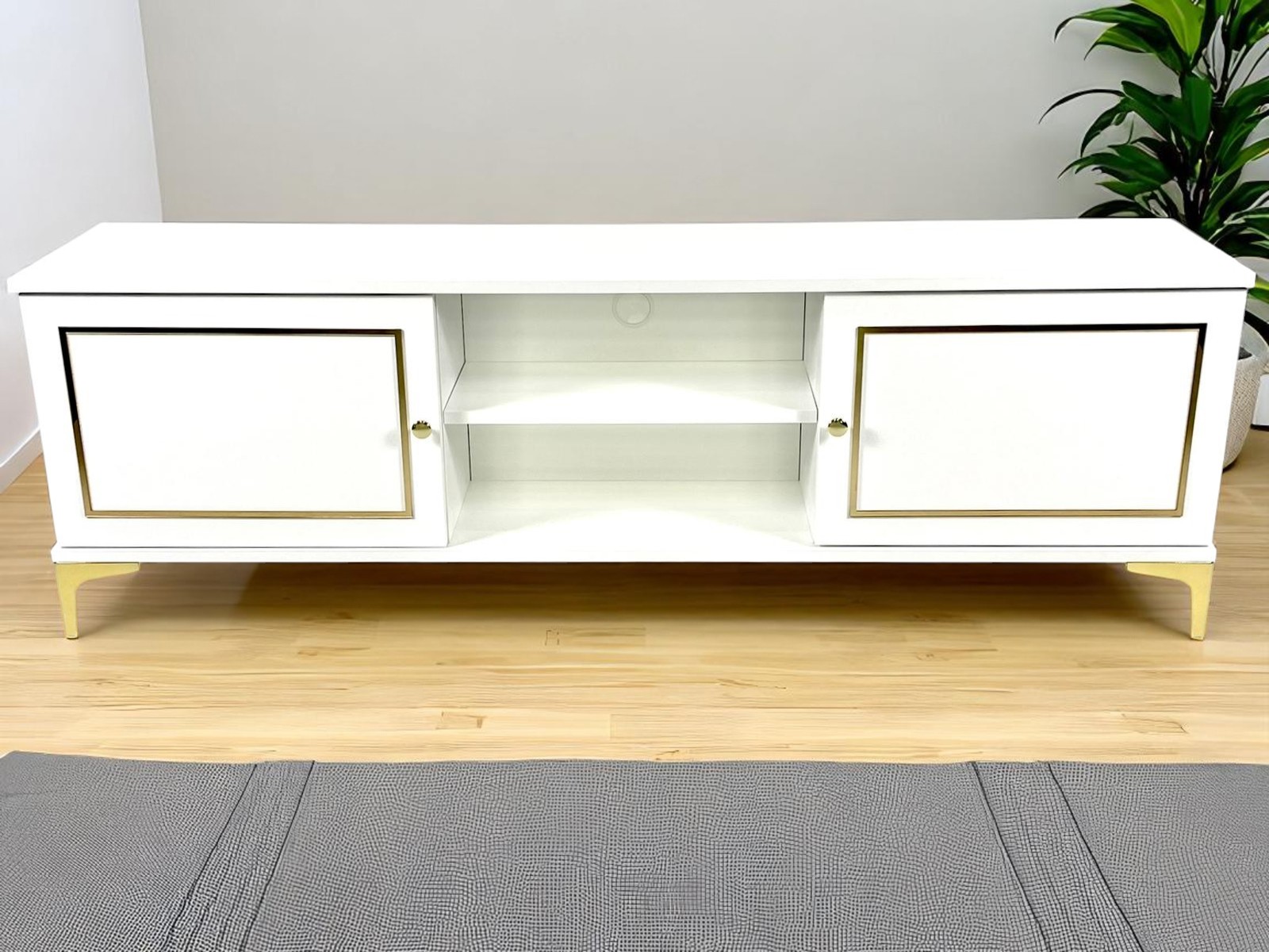 Komoda RTV Lagos drewniana biało-złota w stylu glamour.